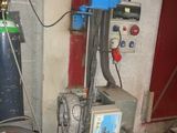 a blue machine that is sitting in a room