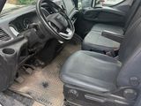 the interior of a white van with a steering wheel and dashboard