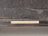 a plaque on the back of an old suitcase