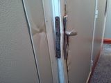 a close up of a door handle on a white door
