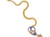 a close up of a necklace with a key on a chain