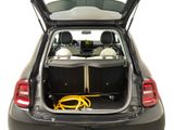 the back of a car with the trunk open and a hose in the trunk