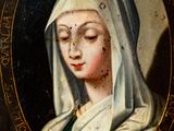 portrait of a woman in a green dress with a white veil