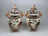 pair of large vases with birds and flowers painted on them