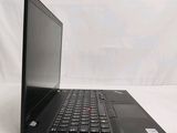 the back of a laptop computer sitting on top of a white surface