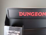 a sign that says dungeon on the side of a black box