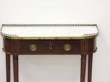 a small table with a marble top on it