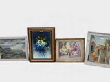 four framed pictures of flowers on a white surface