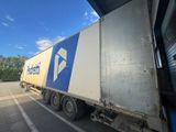 a semi truck that is parked in a parking lot