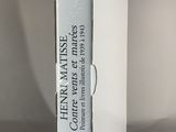 a white box with a book on it sitting on a table