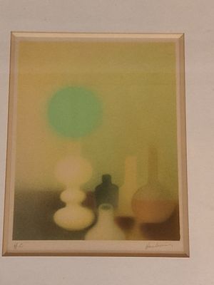 a picture of a picture of a vase and a vase on a table