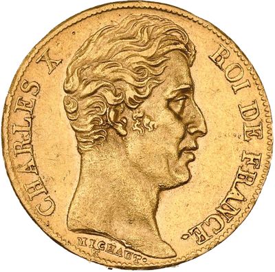 a close up of a gold coin with a woman ' s face
