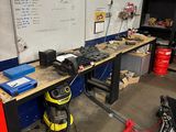 a workbench in a garage with tools on it