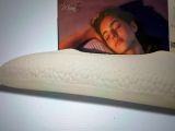 a pillow that has a picture of a woman sleeping on it