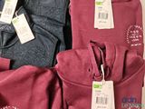 a pile of clothing that has tags on it