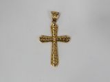a gold cross pendant on a white background