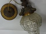 a wall light that is hanging on the wall