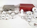 a table that has a lot of dishes and cups on it