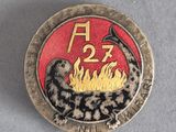 une image représentant un insigne orné d'un serpent