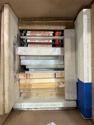 a box full of books sitting on the floor