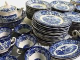 a lot of blue and white plates and cups
