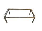 a metal and glass coffee table with a glass top