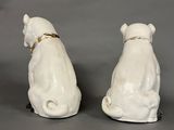 pair of white porcelain dog figurines with gold collars