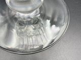 a glass of water sitting on top of a table