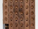 a stack of wooden blocks with holes on them