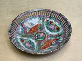 a plate with a design on it sitting on a table