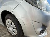 a close up of the front of a car that has been dented