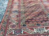an old rug is laying on the ground in the middle of the street