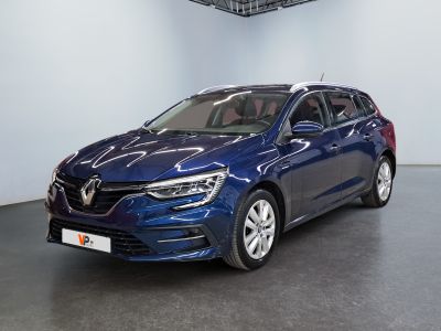 the blue car is parked in a large room with a black floor