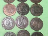 a lot of coins that are on a green surface