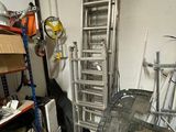 an image of a garage with a ladder in the middle of the room