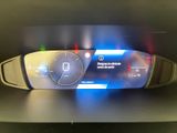 the dashboard of a car with a digital display on it