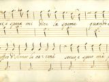 un ancien manuscrit sur lequel sont notées des partitions à l'encre noire