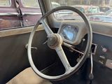 a steering wheel and dashboard of an old car