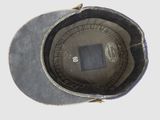 a close up of a hat on a white surface