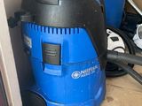 two vacuums that are sitting on the floor next to each other