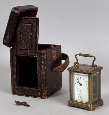 a small wooden box with a clock inside of it