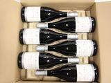 six bottles of wine in a box on the table