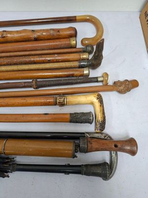 many different types of walking canes on a table