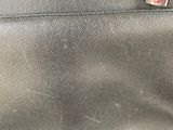 a close up of a bag with a tag on it