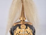 a black and gold hat with a gold crown on it