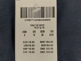 a close up of a label on the back of a shirt