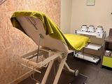 an image of a hospital room with a bed and a chair