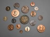 a lot of coins that are on the table
