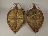 pair of antique metal wall sconces with gold leaf designs
