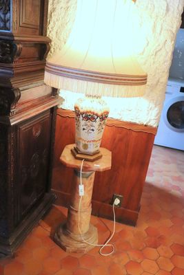 a lamp that is sitting on a table in a room
